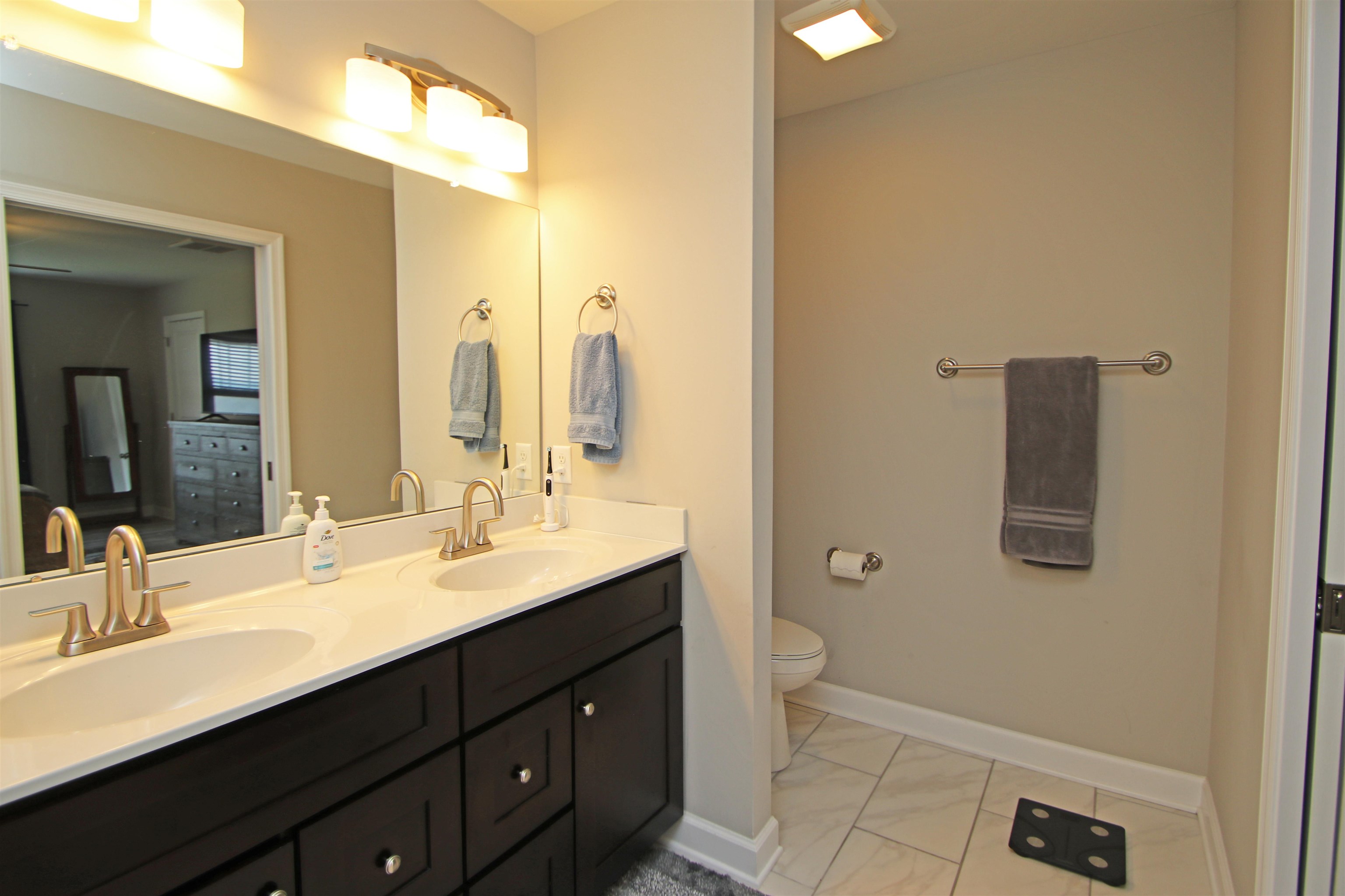 224 Spring Run Lane Waynesboro, VA 22980 - Photo 23 of 52 a bathroom with a double vanity sink and mirror
