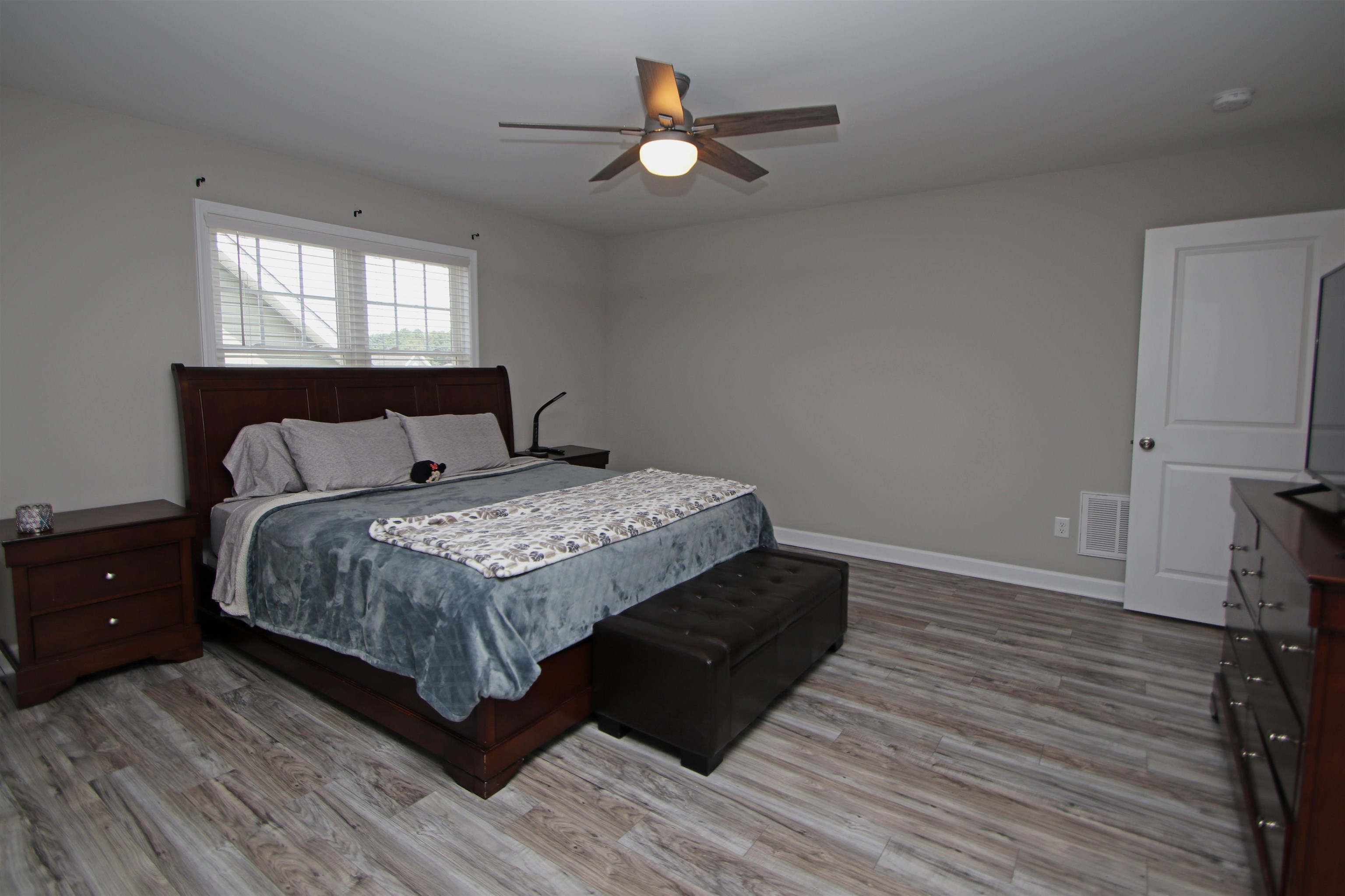 224 Spring Run Lane Waynesboro, VA 22980 - Photo 32 of 52 a bedroom with a bed and a chandelier