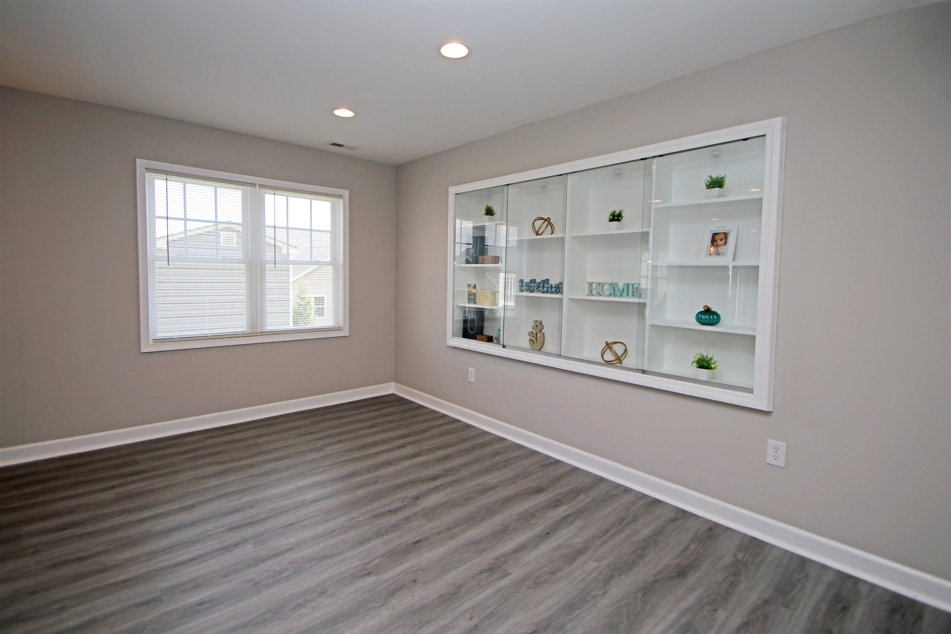 224 Spring Run Lane Waynesboro, VA 22980 - Photo 41 of 52 a view of an empty room with window and wooden floor