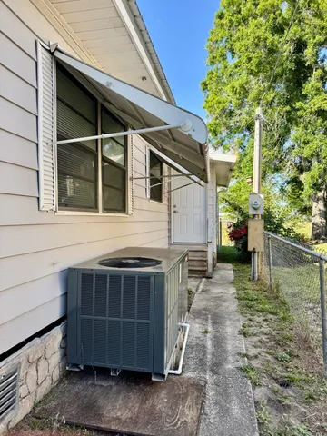 a view of house with backyard