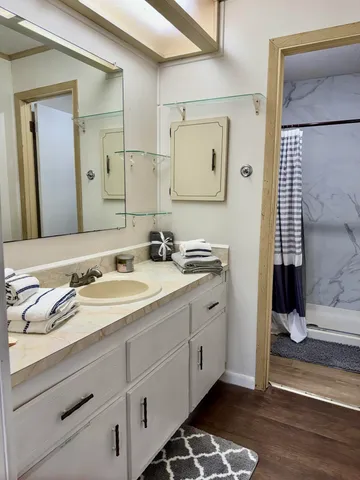 a bathroom with a sink and a mirror