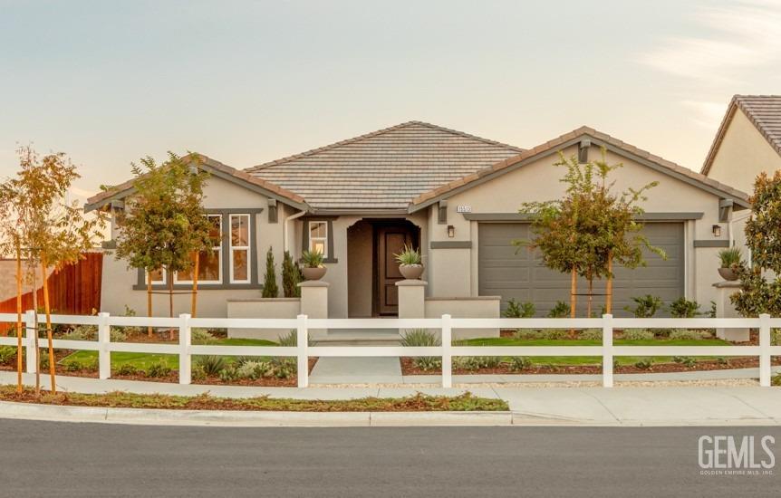 Undisclosed Address Bakersfield, CA 93314 - Photo 1 of 16 front view of a house with a small yard