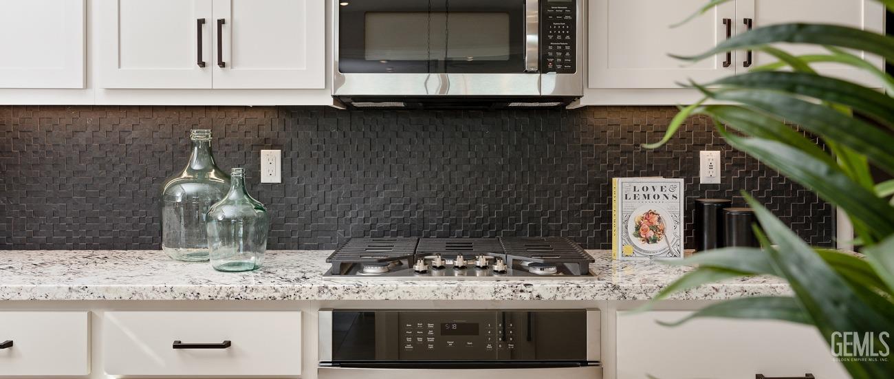 Undisclosed Address Bakersfield, CA 93314 - Photo 6 of 16 a kitchen with a stove and a sink