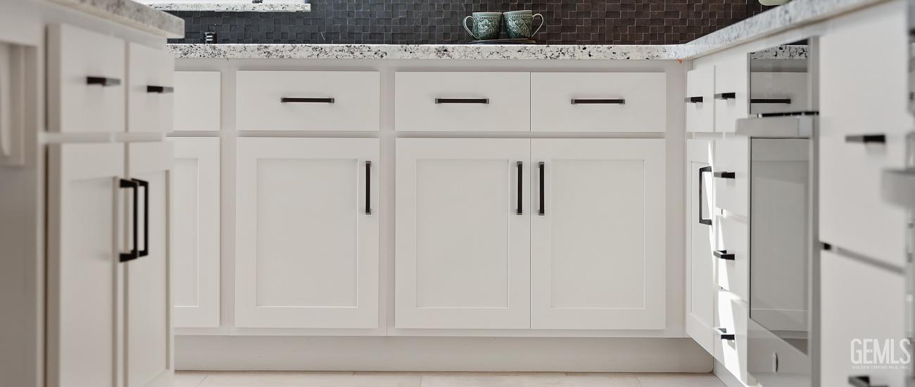 Undisclosed Address Bakersfield, CA 93314 - Photo 9 of 16 a view of a bathroom with white cabinets