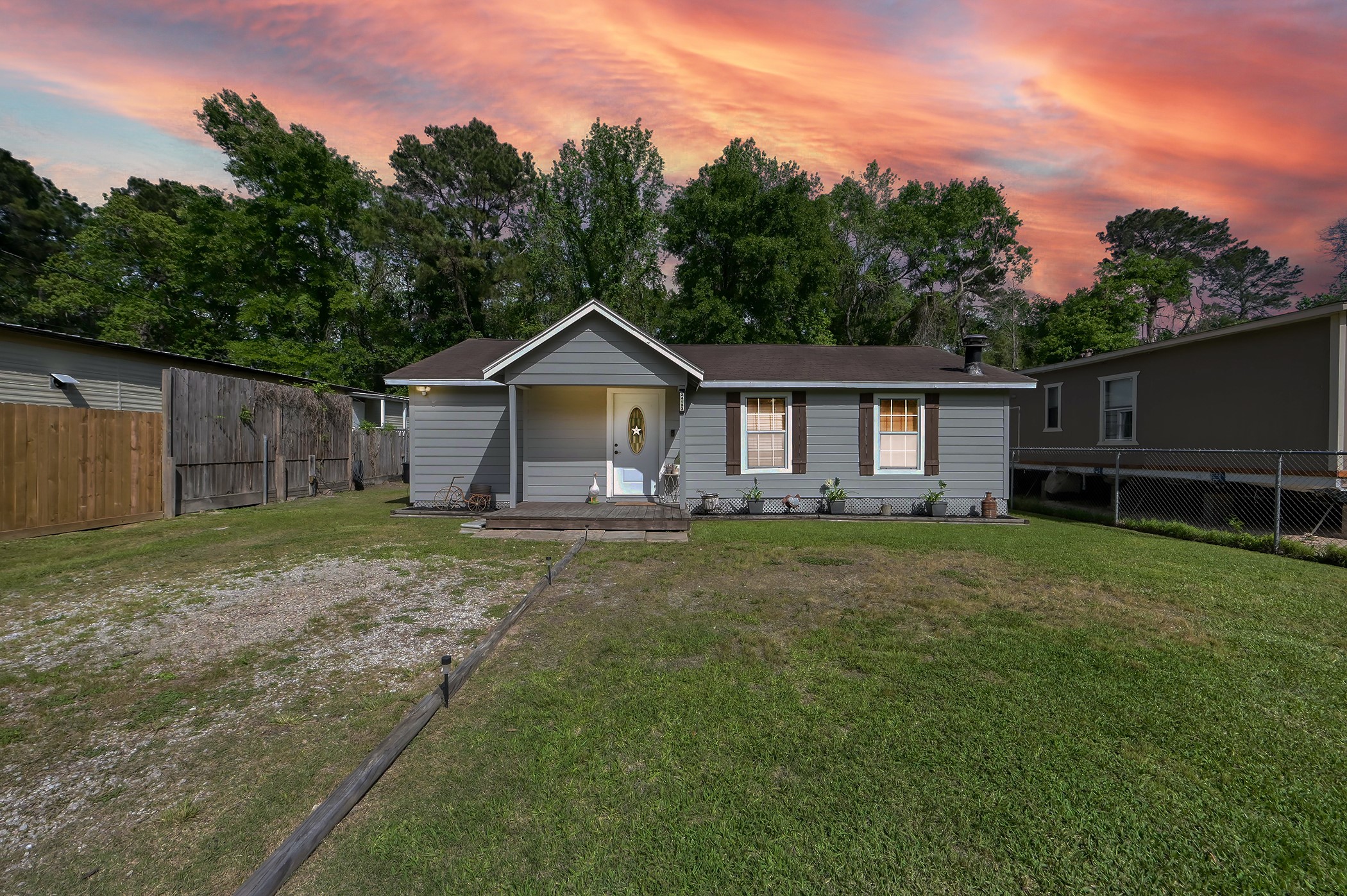 24193 Parker Road Porter, TX 77365 - Photo 2 of 15 a view of a yard in front of a house with large trees