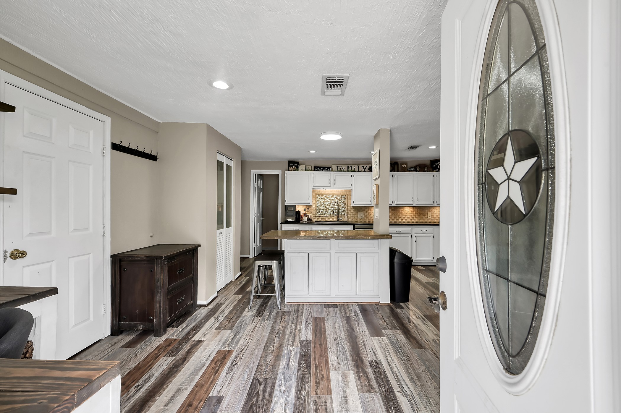 24193 Parker Road Porter, TX 77365 - Photo 3 of 15 a kitchen with a refrigerator and a sink