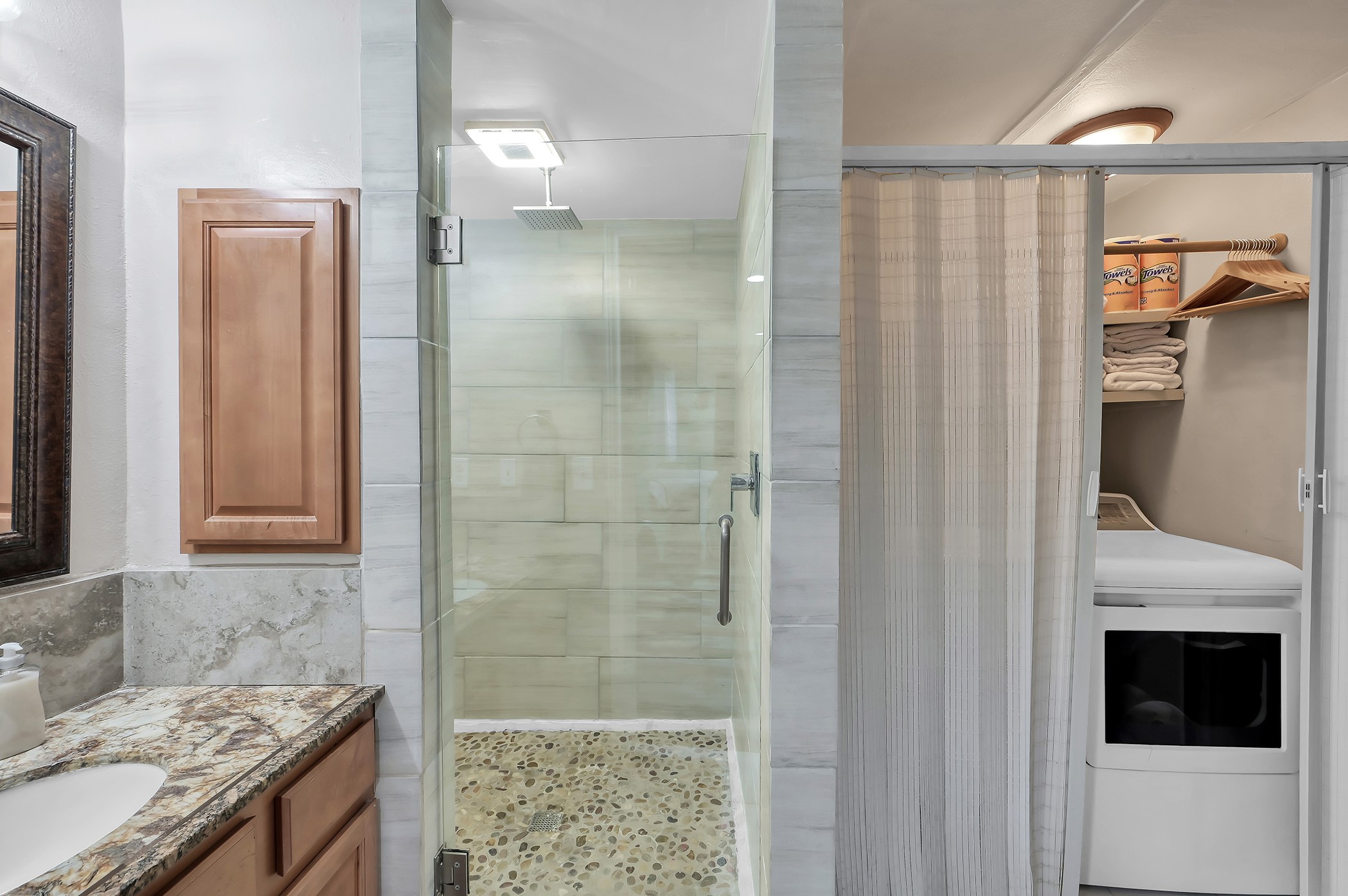 24193 Parker Road Porter, TX 77365 - Photo 9 of 15 a bathroom with a granite countertop shower a sink and a mirror