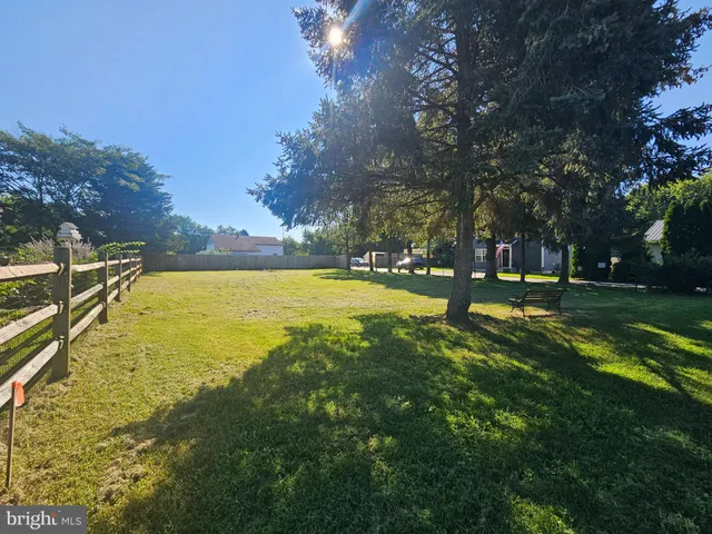 a view of a swimming pool with an outdoor space and seating area
