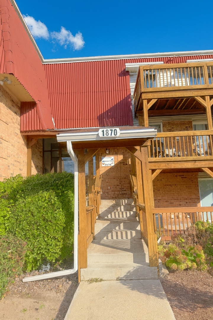 1870 Tall Oaks Drive, Unit 3104 Aurora, IL 60505 - Photo 1 of 16 a front view of a building