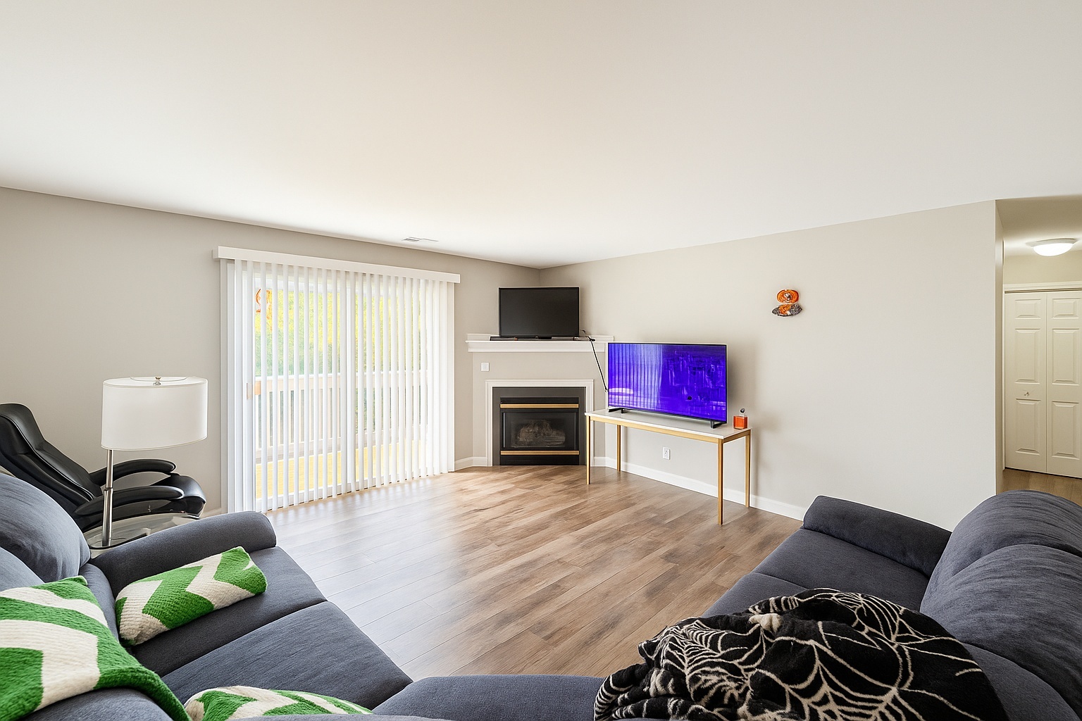 1870 Tall Oaks Drive, Unit 3104 Aurora, IL 60505 - Photo 11 of 16 a living room with furniture and a fireplace