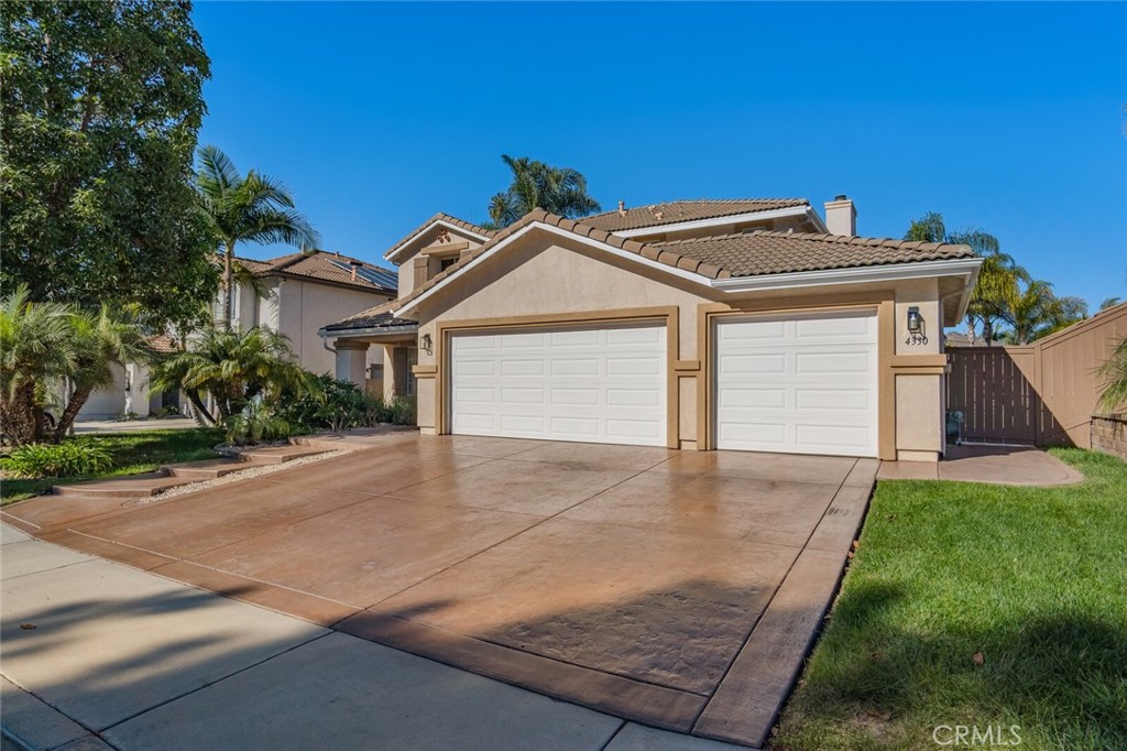 4330 Forest Ranch Way Oceanside, CA 92057 - Photo 2 of 51 From the triple-wide stamped concrete driveway to the manicured landscaping, the curb appeal sets the tone before you even step inside.
