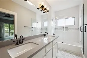 a bathroom with a tub sink and mirror