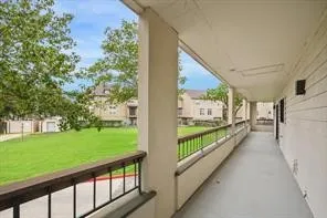 a view of porch with a yard