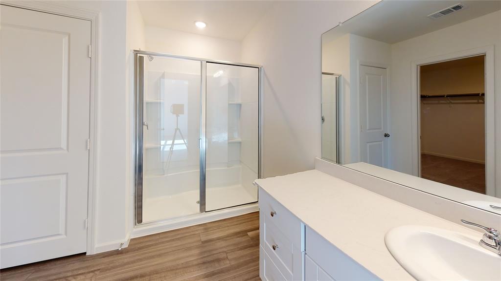 1706 Washington Street Princeton, TX 75407 - Photo 12 of 19 a bathroom with a shower and a sink