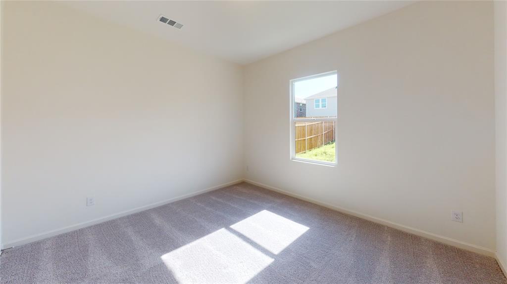 1706 Washington Street Princeton, TX 75407 - Photo 14 of 19 an empty room with a window