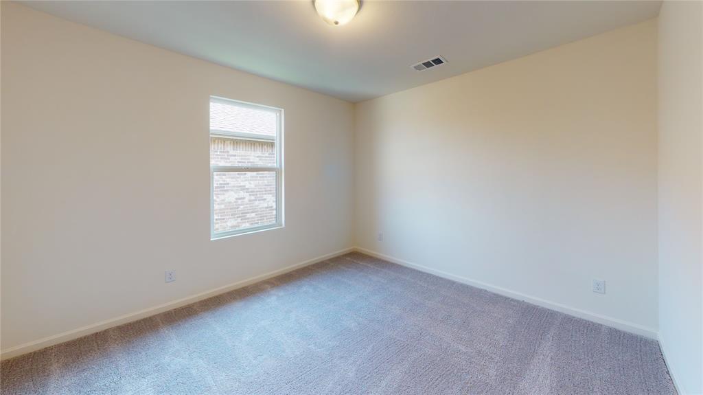 1706 Washington Street Princeton, TX 75407 - Photo 16 of 19 an empty room with a window