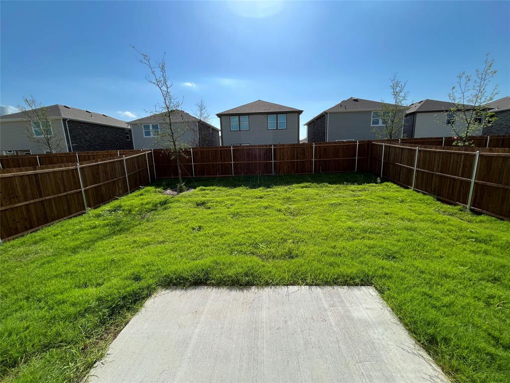 1706 Washington Street Princeton, TX 75407 - Photo 18 of 19 a view of a backyard