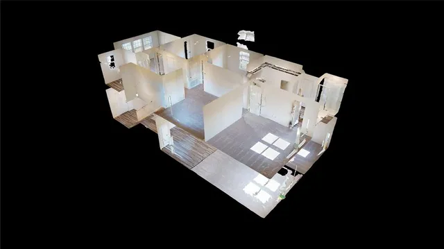 a white bed sitting in a living room