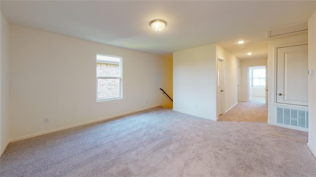 1706 Washington Street Princeton, TX 75407 - Photo 8 of 19 an empty room with windows and entrance