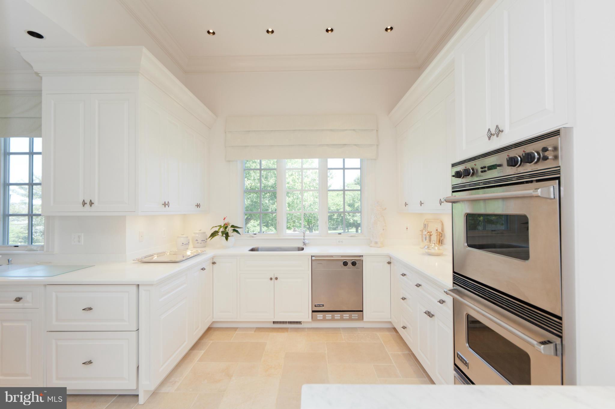 1234 Cherry Tree Lane Annapolis, MD 21403 - Photo 11 of 29 a kitchen with a sink stove and cabinets