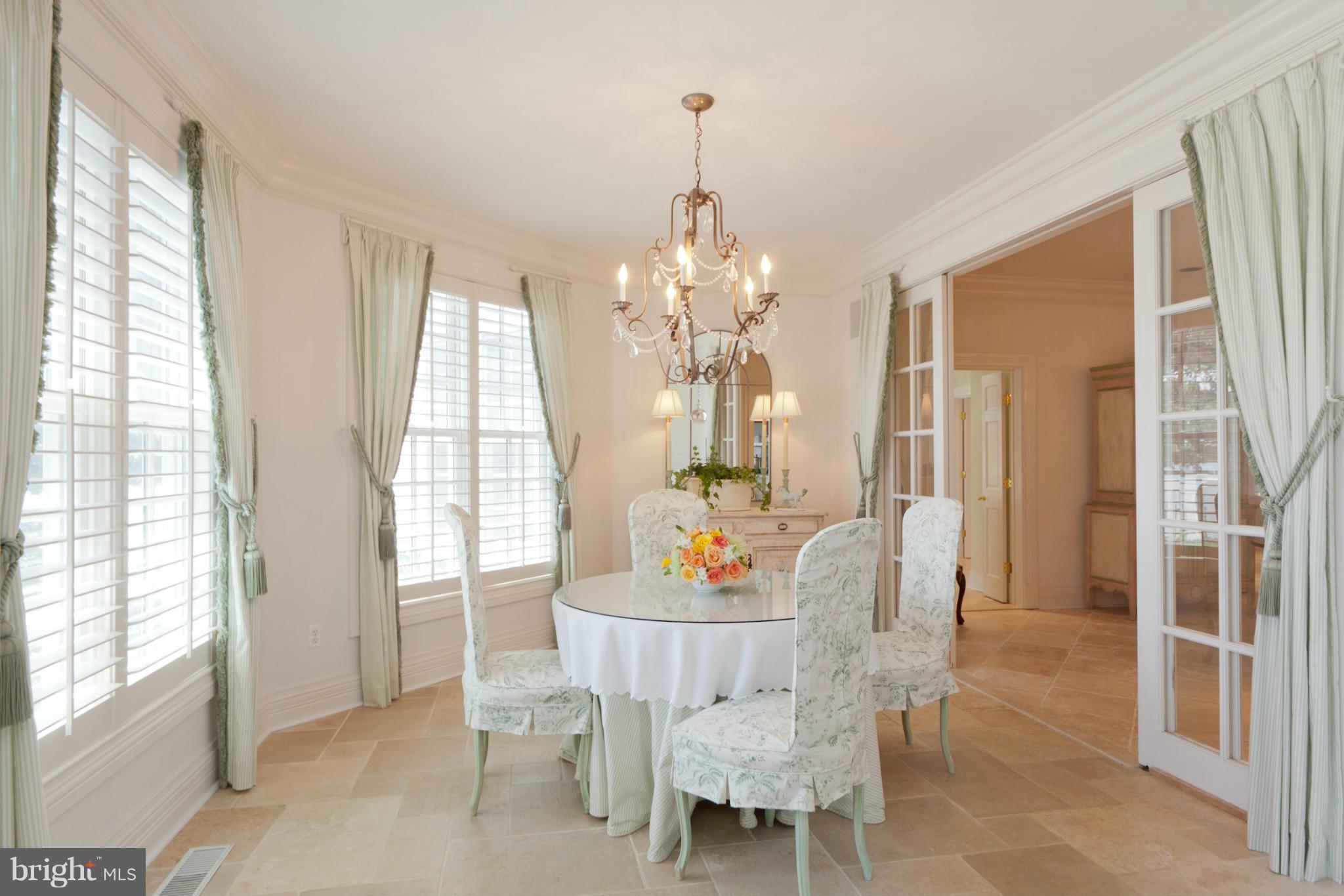 1234 Cherry Tree Lane Annapolis, MD 21403 - Photo 12 of 29 a dining room with furniture a chandelier and wooden floor
