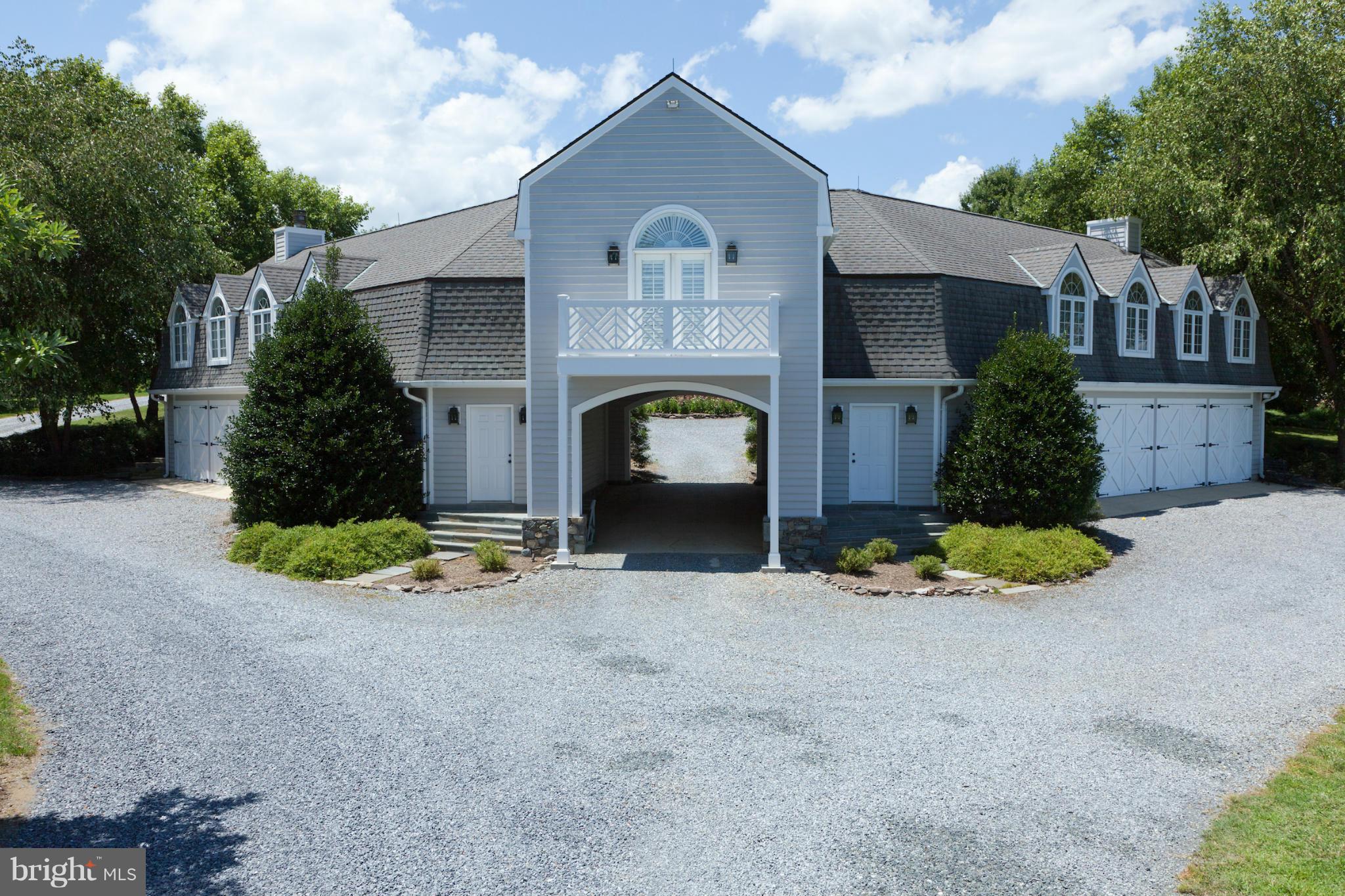 1234 Cherry Tree Lane Annapolis, MD 21403 - Photo 3 of 29 a front view of a house with a garden and plants