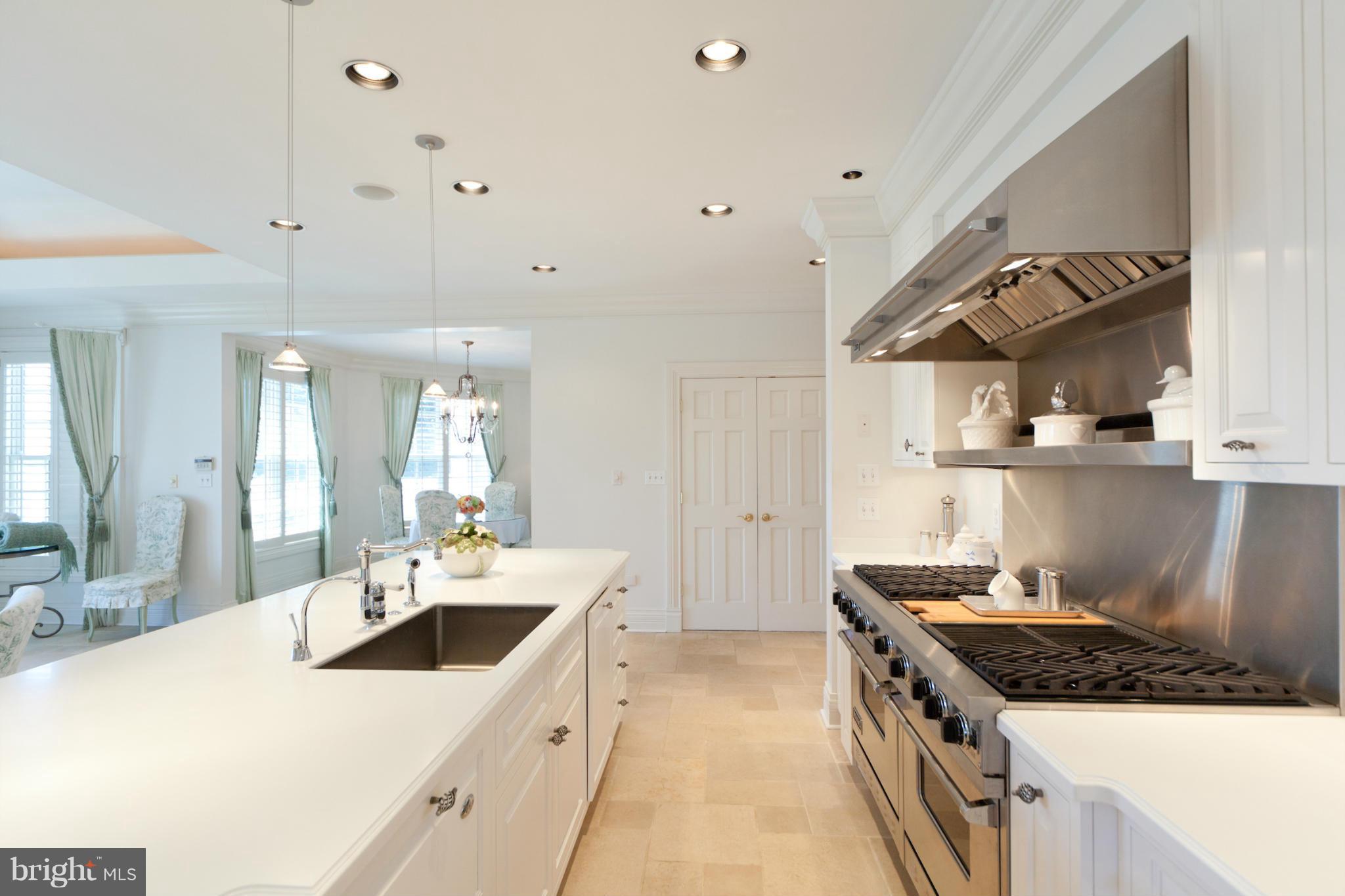 1234 Cherry Tree Lane Annapolis, MD 21403 - Photo 10 of 29 a kitchen with a stove a sink and a refrigerator