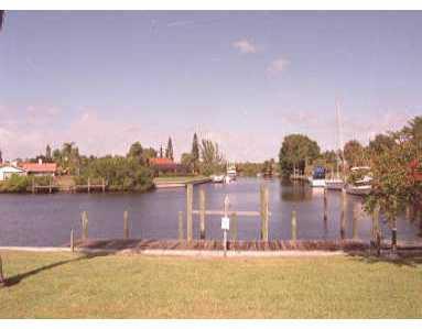 102 Northwest S Shore Road Stuart, FL 34994 - Photo 1 of 1 a view of a lake with a city