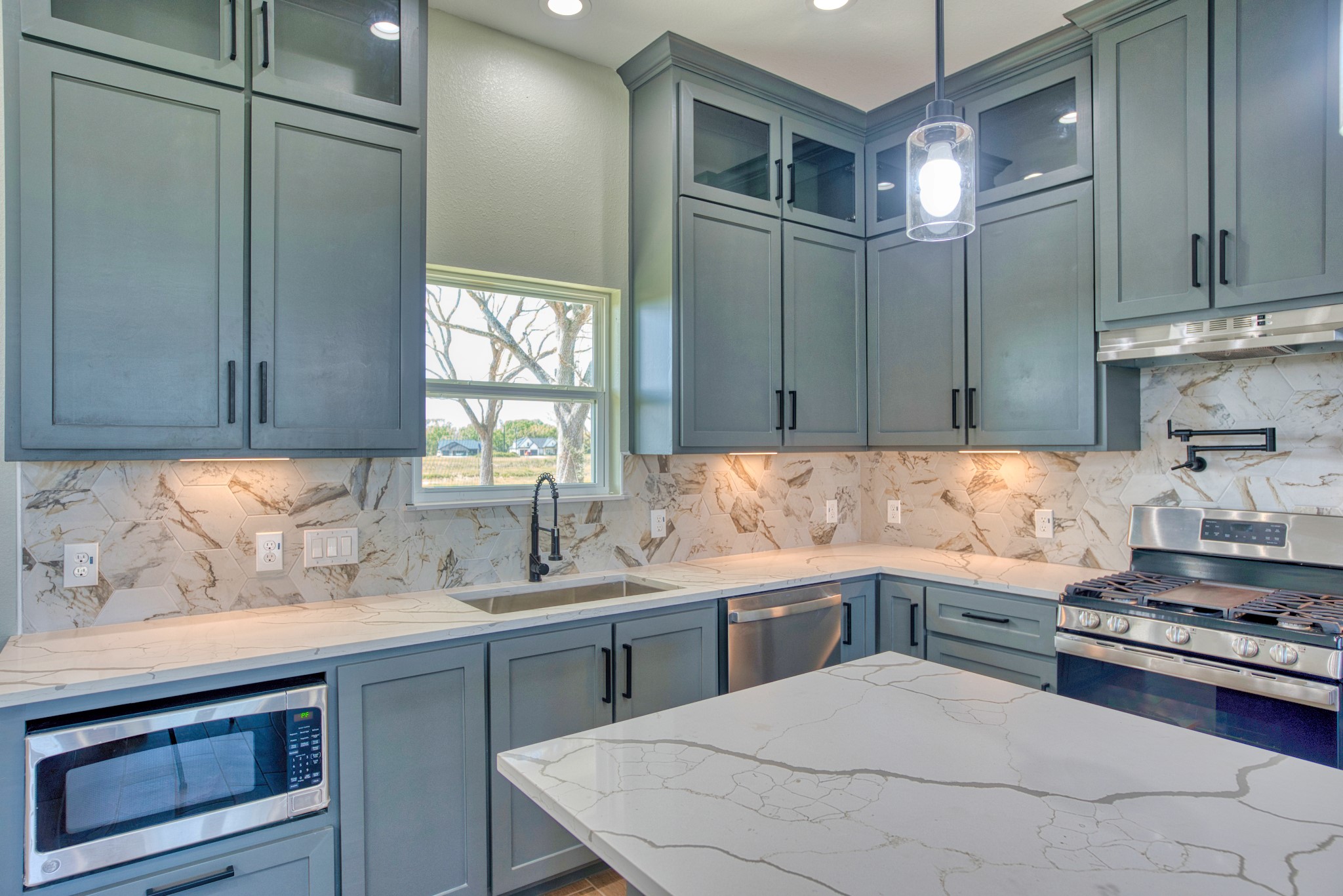 925 Buffalo Trail Angleton, TX 77515 - Photo 23 of 45 a kitchen with a sink stove and cabinets