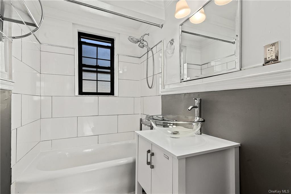 26 Pondfield Road, Unit 3C Bronxville, NY 10708 - Photo 6 of 15 Updated bathroom with tub and shower.