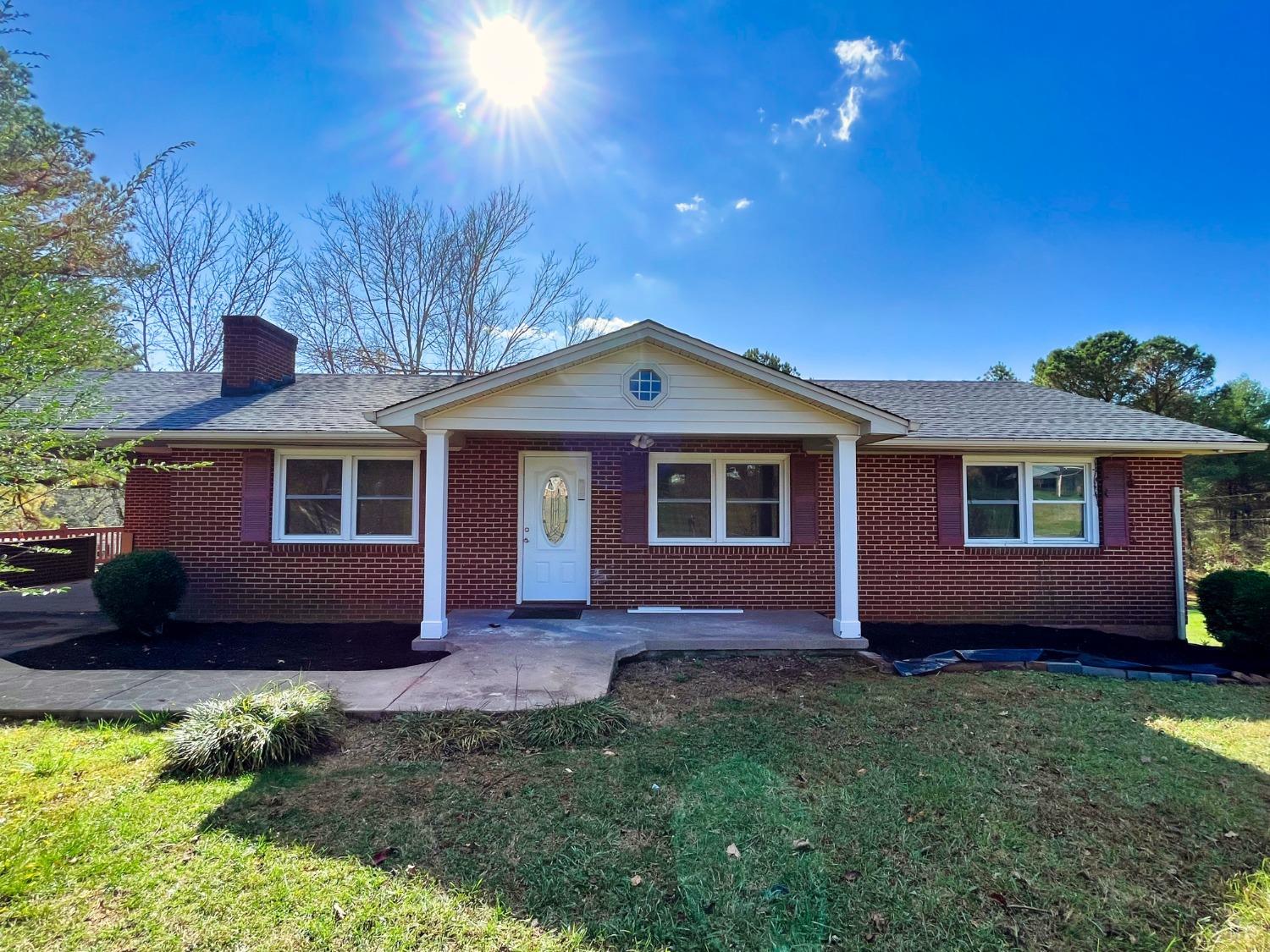 288 Lynbrook Road Rustburg, VA 24588 - Photo 1 of 34 a front view of a house with a garden