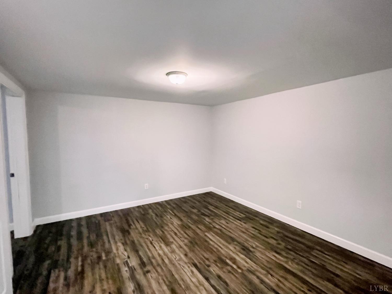 288 Lynbrook Road Rustburg, VA 24588 - Photo 21 of 34 a view of room with wooden floor