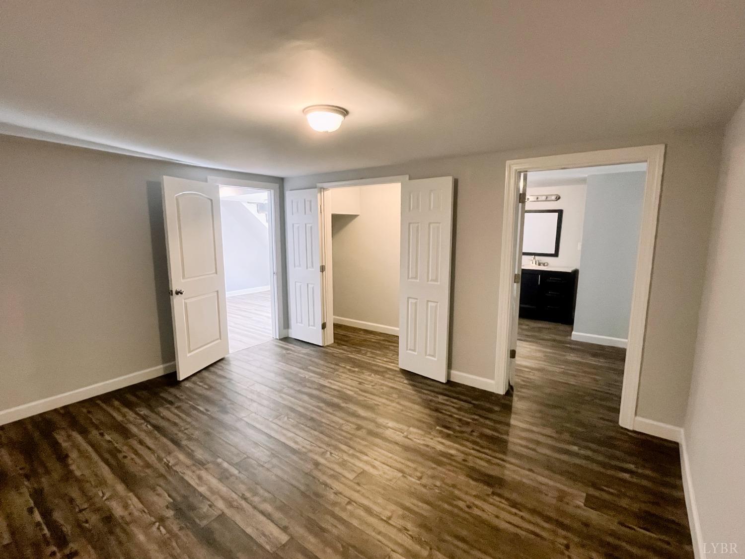 288 Lynbrook Road Rustburg, VA 24588 - Photo 22 of 34 a view of a room with wooden floor and a window