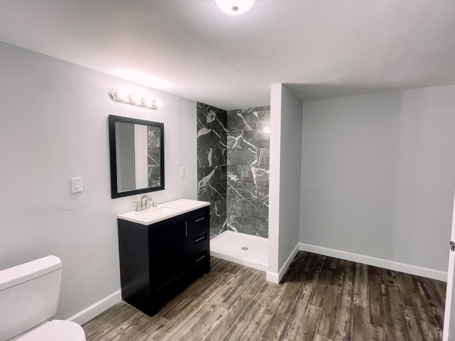 288 Lynbrook Road Rustburg, VA 24588 - Photo 24 of 34 a view of bathroom with a toilet sink and mirror