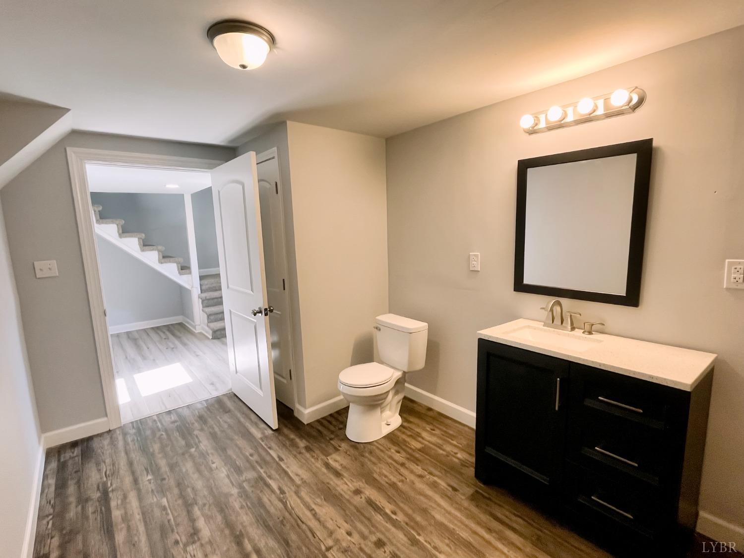 288 Lynbrook Road Rustburg, VA 24588 - Photo 26 of 34 a bathroom with a toilet sink and mirror