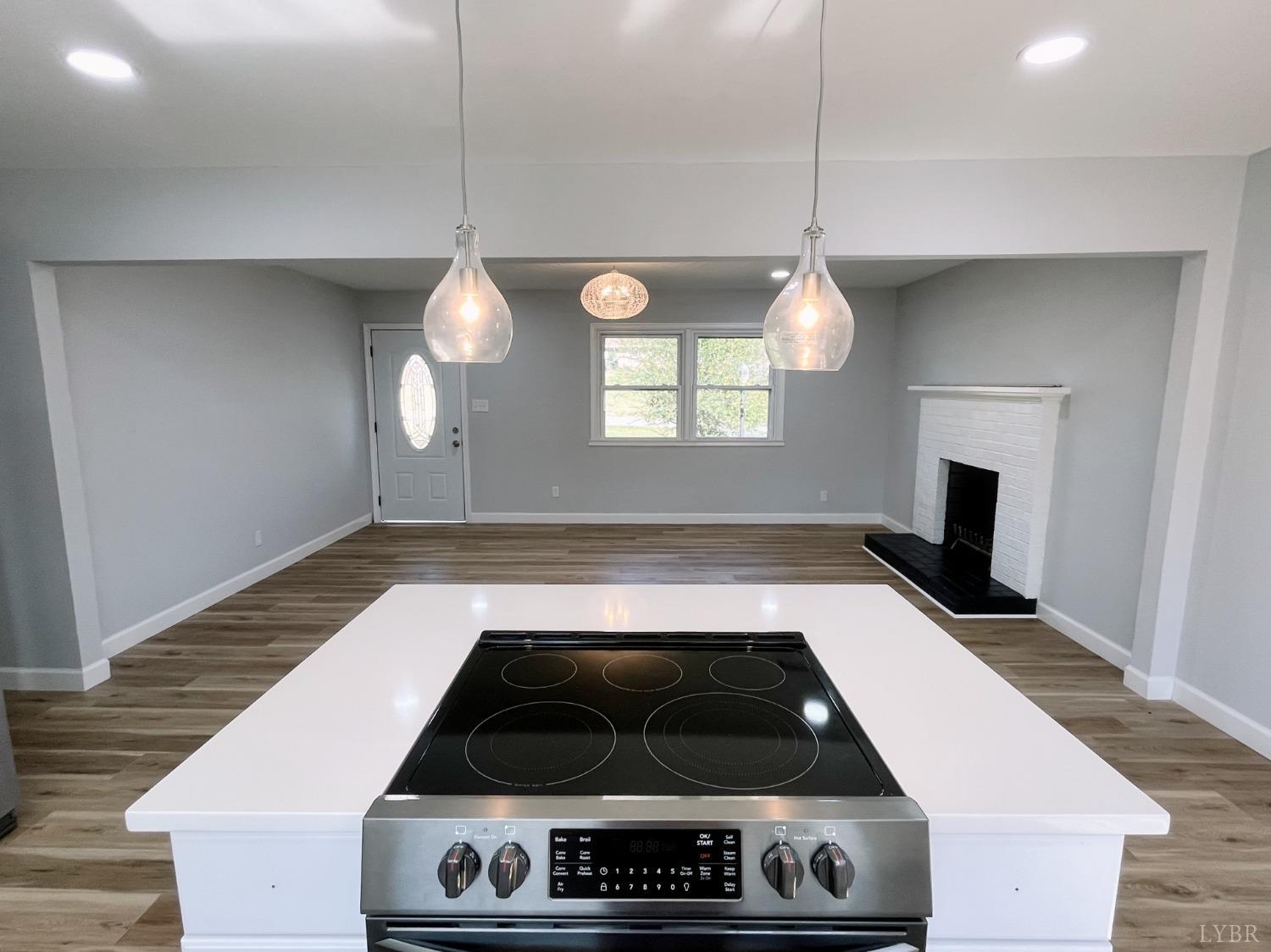 288 Lynbrook Road Rustburg, VA 24588 - Photo 6 of 34 a kitchen with a stove and a wooden floor