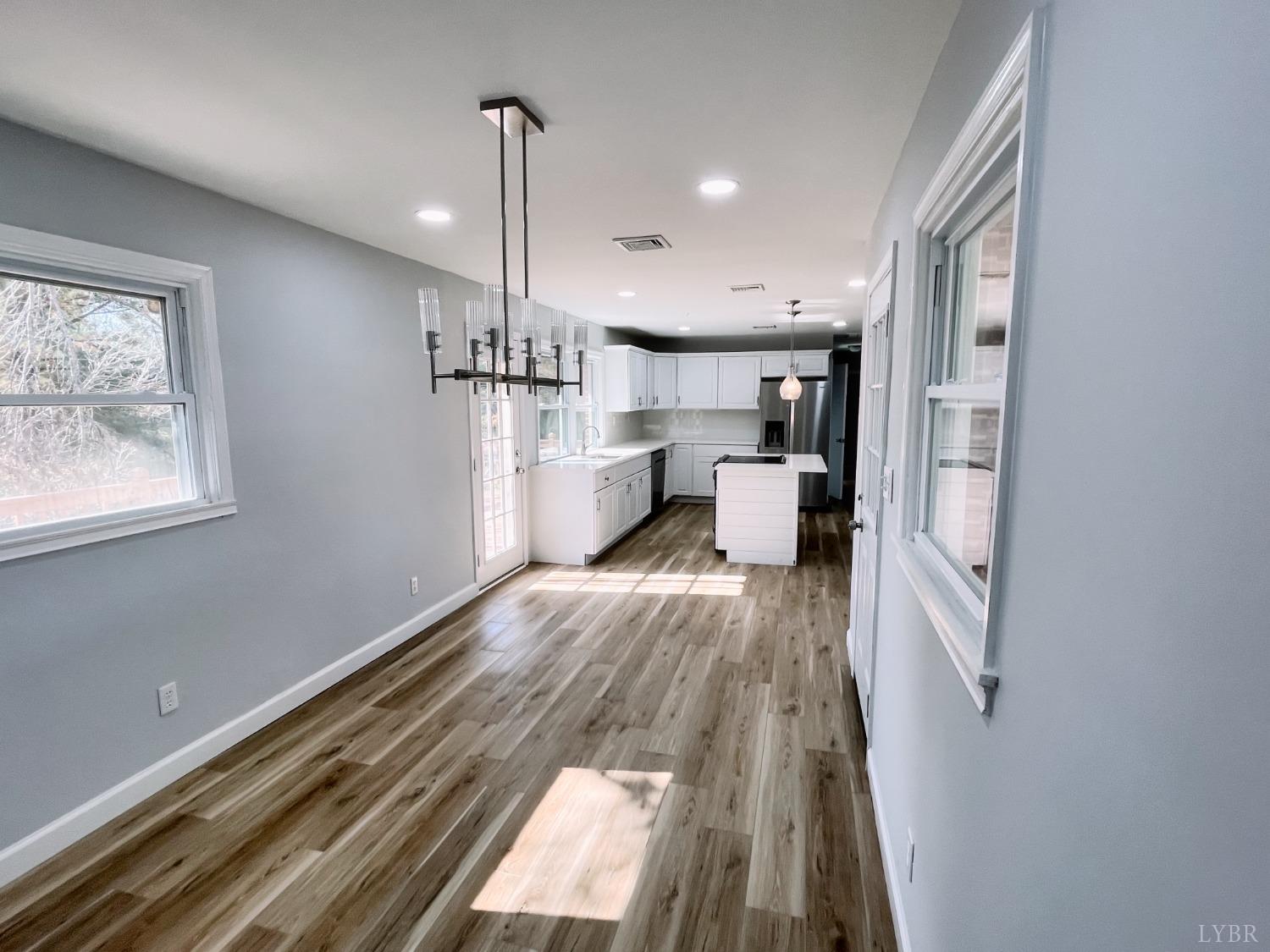 288 Lynbrook Road Rustburg, VA 24588 - Photo 9 of 34 a view of kitchen with furniture and wooden floor