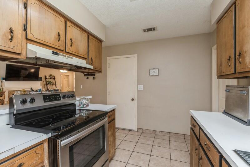 422 John King Road Crestview, FL 32539 - Photo 13 of 30 a kitchen with a stove and a microwave