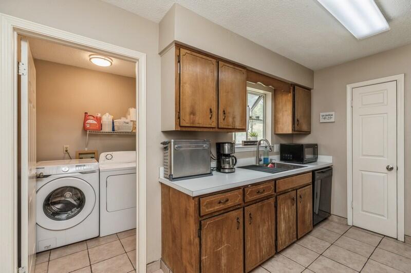 422 John King Road Crestview, FL 32539 - Photo 14 of 30 a kitchen with stainless steel appliances granite countertop a sink a stove and cabinets