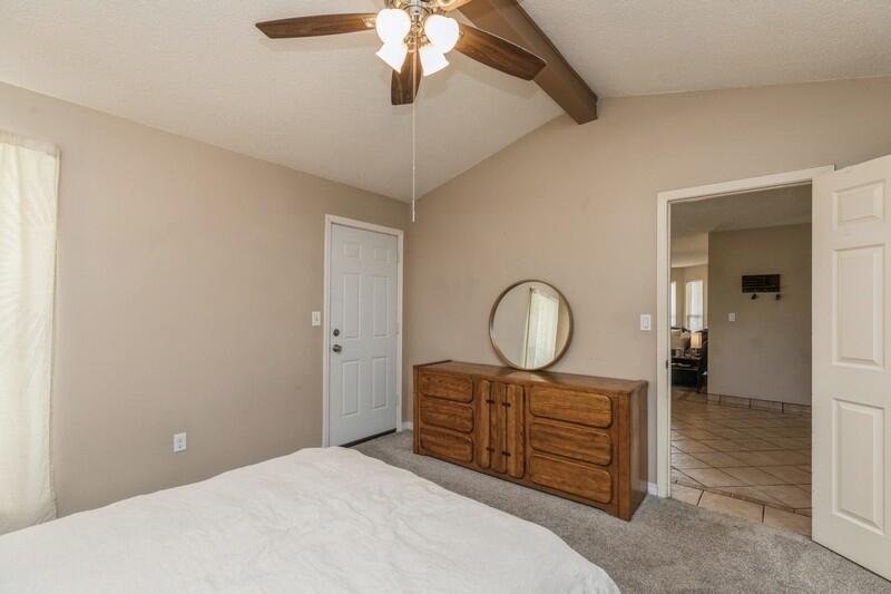 422 John King Road Crestview, FL 32539 - Photo 21 of 30 a bed room with a bed and a chandelier