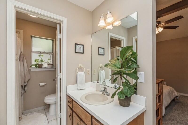 422 John King Road Crestview, FL 32539 - Photo 23 of 30 a bathroom with a granite countertop a sink a toilet and a mirror