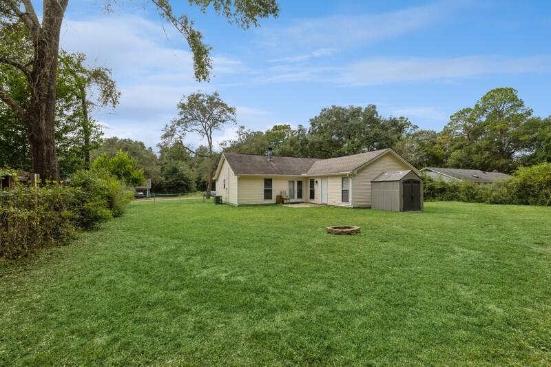 422 John King Road Crestview, FL 32539 - Photo 26 of 30 a front view of a house with a yard