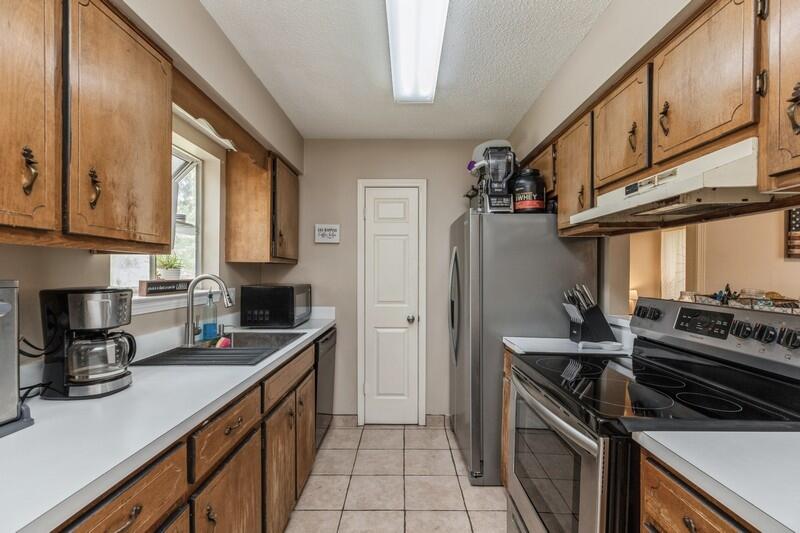 422 John King Road Crestview, FL 32539 - Photo 10 of 30 a kitchen with a stove and a sink