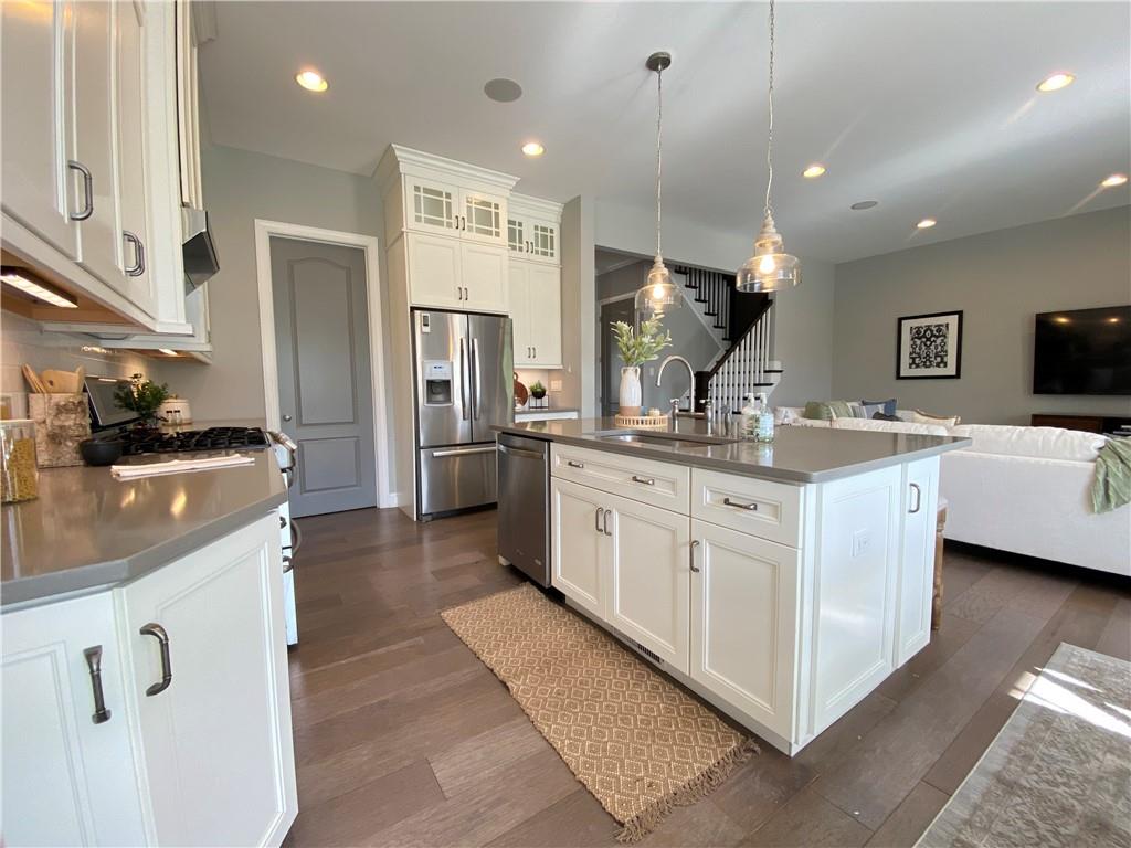239 Venango Trail Mars, PA 16046 - Photo 11 of 39 a kitchen with a sink a counter top space stainless steel appliances and cabinets