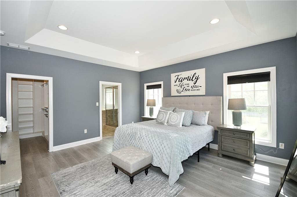 239 Venango Trail Mars, PA 16046 - Photo 20 of 39 a bedroom with a bed and wooden floor