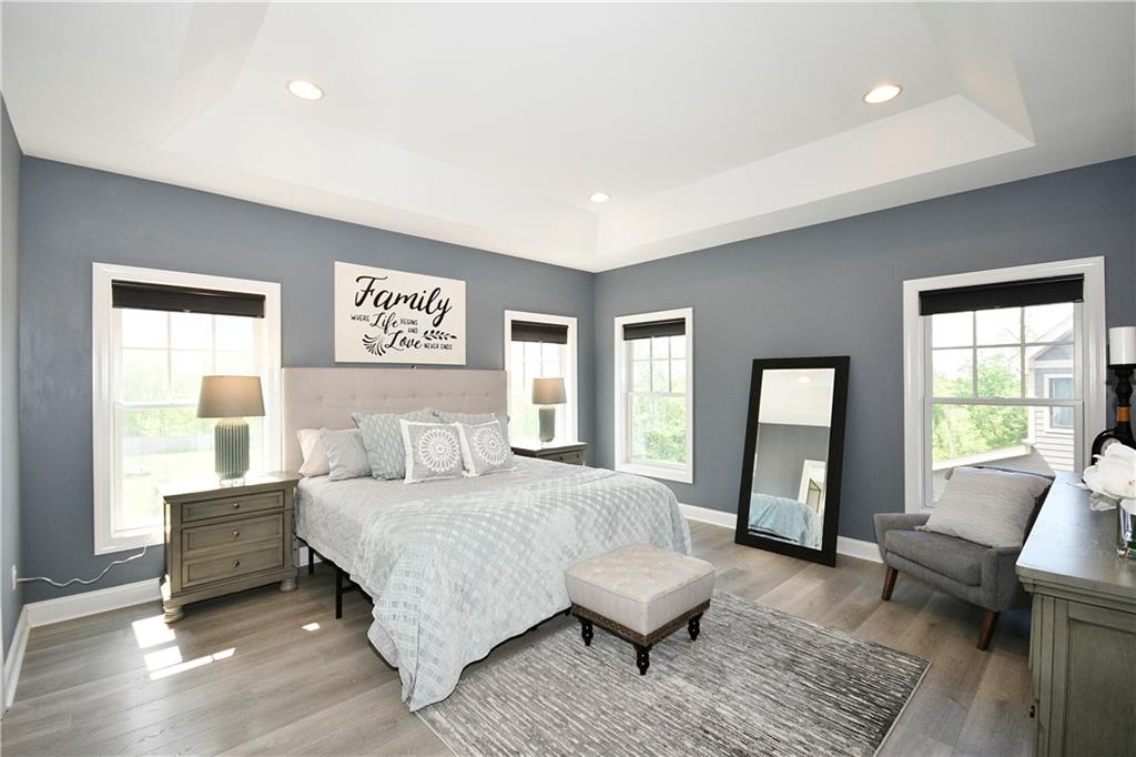 239 Venango Trail Mars, PA 16046 - Photo 21 of 39 a bedroom with a bed couch and a window