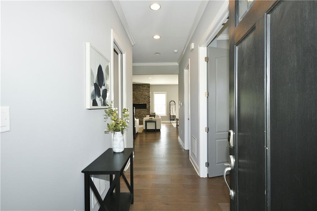 239 Venango Trail Mars, PA 16046 - Photo 3 of 39 a view of a hallway with living room and furniture