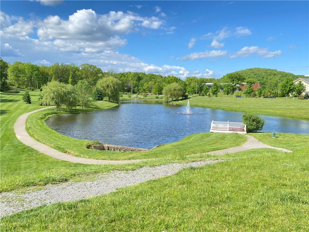 239 Venango Trail Mars, PA 16046 - Photo 38 of 39 a view of a lake with houses in the back