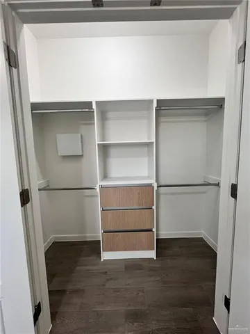 a view of an empty walk in closet