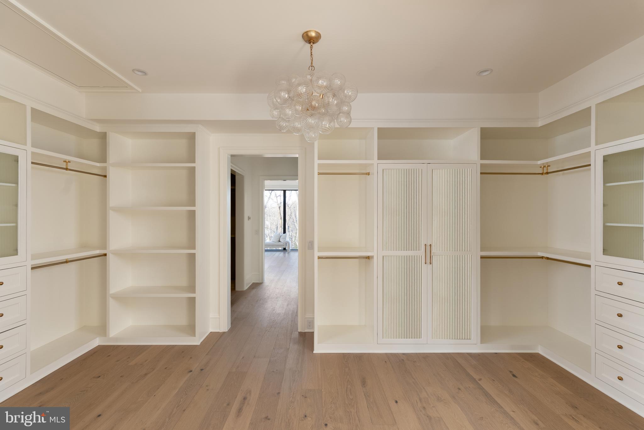 8634 Overlook Road McLean, VA 22102 - Photo 47 of 76 Custom closet with fluted glass cabinetry